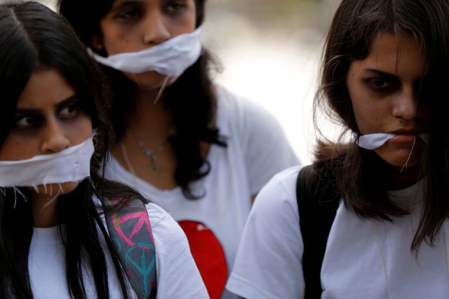 Demonstrators attend a rally against Venezuela's President Nicolas Maduro's government in Caracas, Venezuela