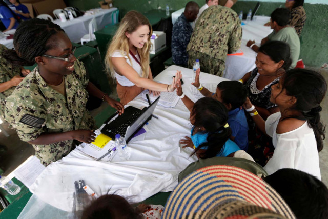 Patients are attended by staff of the United States Navy hospital ship USNS Comfort at the Divina Pastora high school in Riohacha