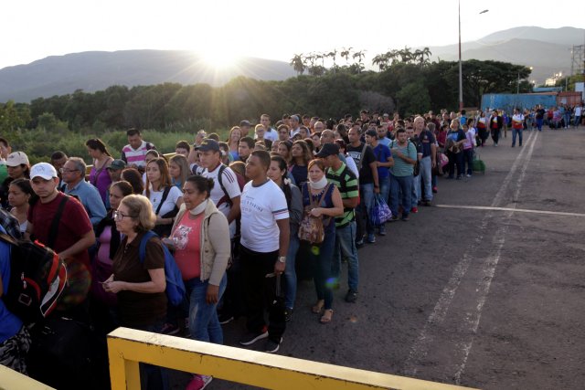 People walk on the Simon Bolivar cross-border bridge between Venezuela and Colombia, on the Venezuelan side of the border, as seen from Cucuta
