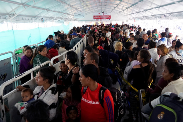 Venezuelans cross into Ecuador from Colombia, some to reach Peru ahead of a June 15 deadline of new migration laws, at the Rumichaca International Bridge in Tulcan