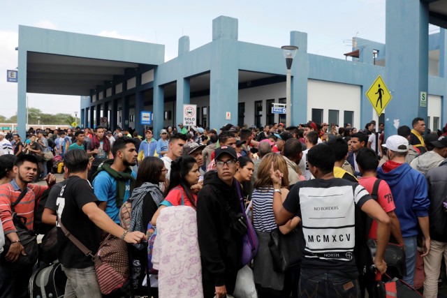 Venezuelans wait at the Binational Border Service Center of Peru in Tumbes