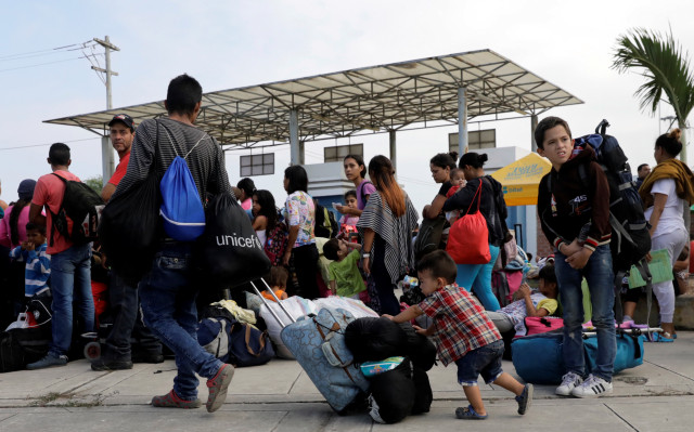Venezuelans wait at the Binational Border Service Center of Peru in Tumbes